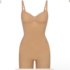 SKIMS SEAMLESS SCULPT MID THIGH BODYSUIT, in the color tan ochre.